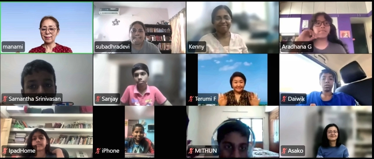Students and Japanese guests together in a twelve-person video class